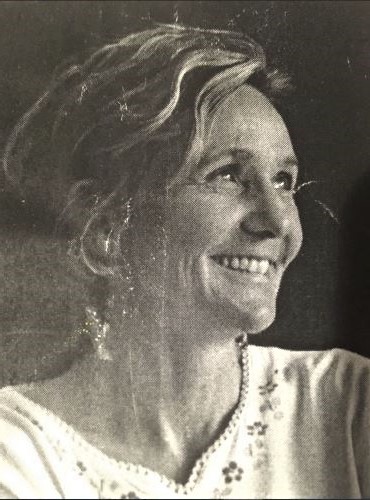 Creative Visualizations Page. A Vintage picture of a woman waring a white embroidered blouse. She is smiling and looking up to the right.